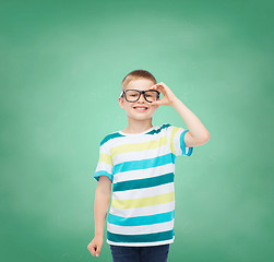 Image showing smiling little boy in eyeglasses