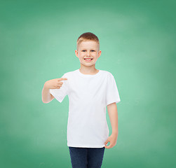 Image showing little boy in white t-shirt pointing his finger