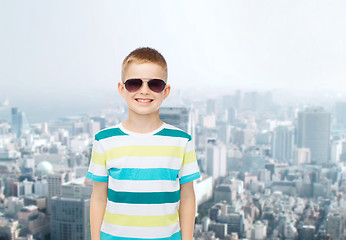 Image showing smiling little boy over green background