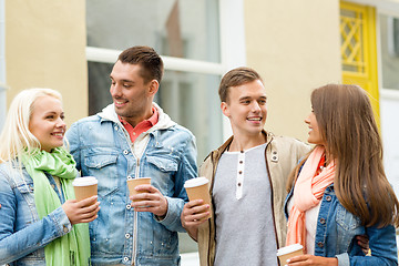 Image showing group of smiling friends with take away coffee