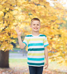 Image showing little boy in casual clothes making OK gesture