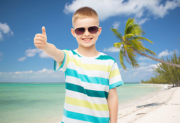 Image showing smiling little boy over green background