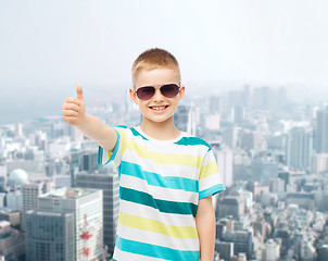 Image showing smiling little boy over green background