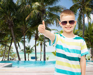 Image showing smiling little boy over green background