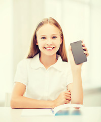 Image showing girl with smartphone at school