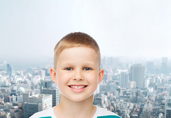 Image showing smiling little boy over green background