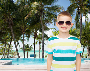 Image showing smiling little boy over green background