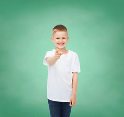 Image showing little boy in white t-shirt pointing his finger