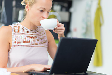 Image showing Business woman working from home.