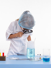 Image showing Chemist regards lather flask