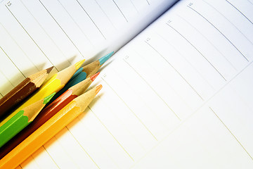 Image showing Color pencil and agenda