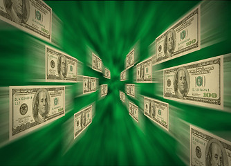 Image showing $100 bills flying through a green vortex