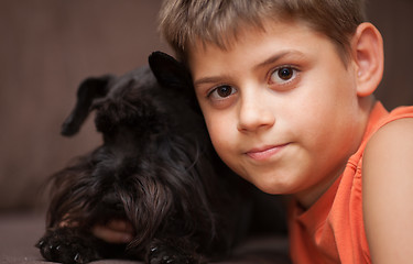 Image showing Little boy with his dog
