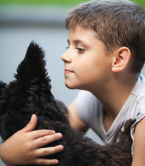 Image showing Little boy and his dog