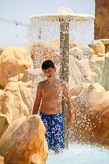 Image showing boy in tunisian aquapark resort under shower