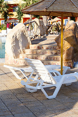 Image showing sunloungers on swimming pool 