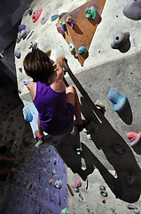 Image showing Child exercising at bouldering gym 