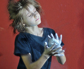 Image showing child with a ball of powder magnesia chalk