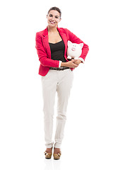 Image showing Business woman with a piggy bank