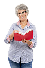 Image showing Elderly woman reading a book