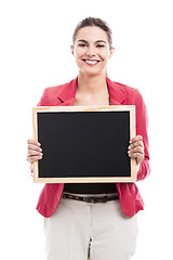 Image showing Business woman holding a shalk board