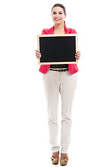 Image showing Business woman holding a shalk board