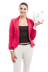 Image showing Business woman with a piggy bank