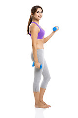 Image showing Athletic woman lifting weights