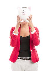 Image showing Business woman with a piggy bank
