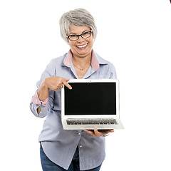 Image showing Elderly woman showing something on a laptop