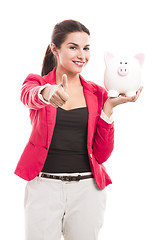 Image showing Business woman with a piggy bank