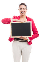 Image showing Business woman holding a shalk board