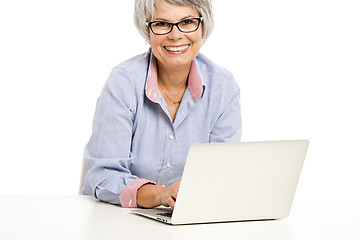 Image showing Ellderly woman working with a laptop