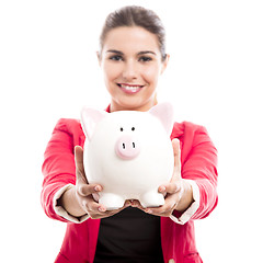 Image showing Business woman with a piggy bank