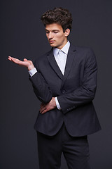 Image showing Businessman showing something