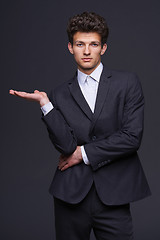 Image showing Businessman showing something