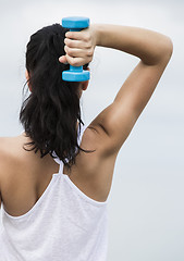 Image showing Woman doing exercises with weights 