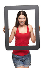 Image showing Excited teen girl looking through frame,