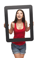 Image showing Excited teen girl looking through frame