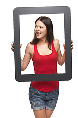 Image showing Excited teen girl looking through frame