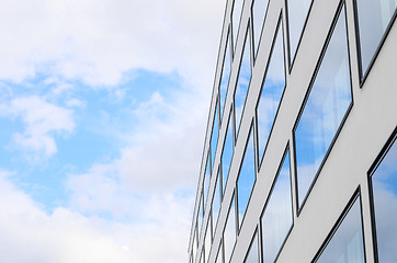 Image showing Blue sky and clouds reflected windows of modern building