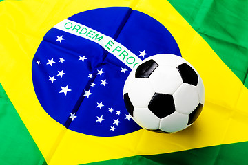 Image showing Waved Brazilian flag and football