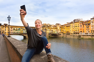 Image showing Lady taking selfie in Florence.