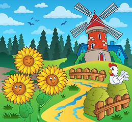 Image showing Sunflowers near windmill