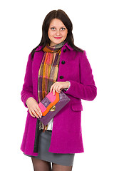 Image showing girl in a coat and a clutch bag