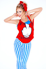 Image showing Young blond woman in a red and blue outfit