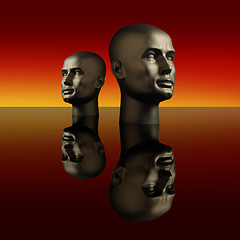 Image showing Two mannequin heads on a dark reflective surface