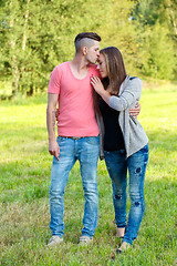 Image showing Happy kissing young couple outdoor