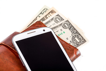 Image showing cellphone and money on white