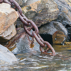 Image showing Heavy chain disappearing in the dark water